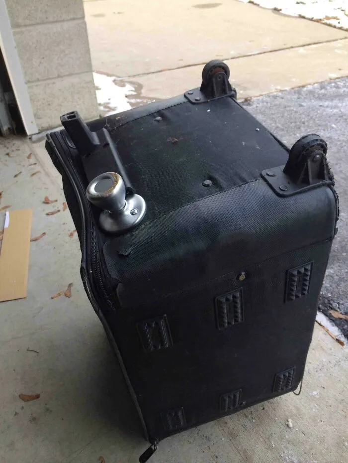 A door knob installed on the bottom of a suitcase for redneck fixes