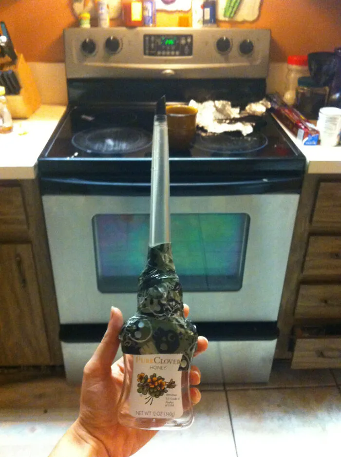 A honey bottle repurposed with a spout top as clever redneck fixes.