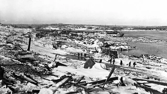A wide-angle historical view of a devasted landscape, depicting expensive accidents.
