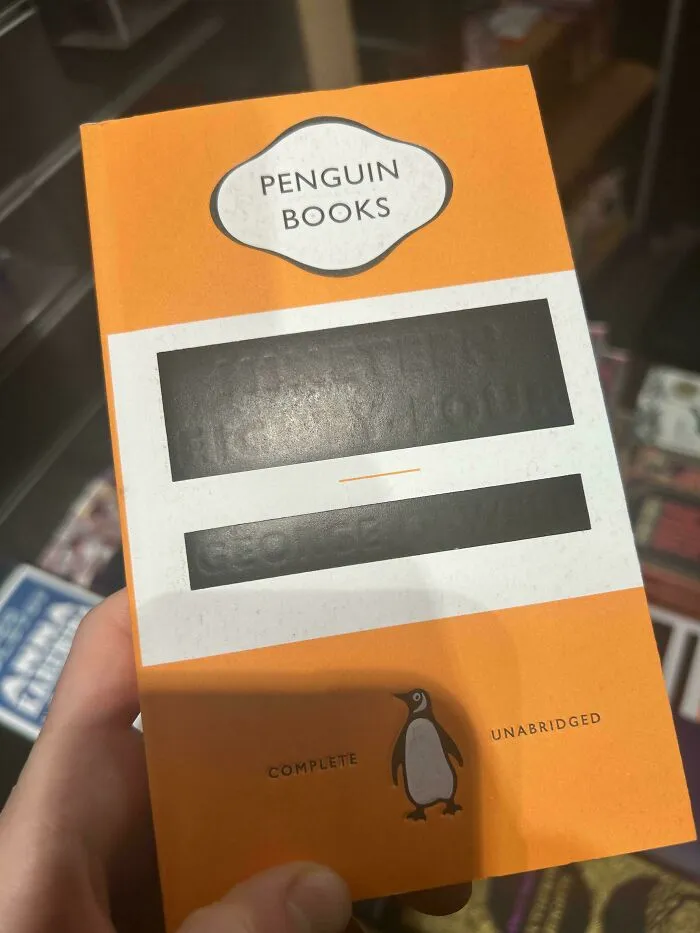 Orange cover of George Orwell Nineteen Eighty-Four book with blacked-out title text, clever ideas