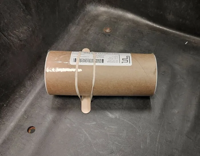 Mailing tube shipped with popsicle stick as a clever idea to prevent rolling