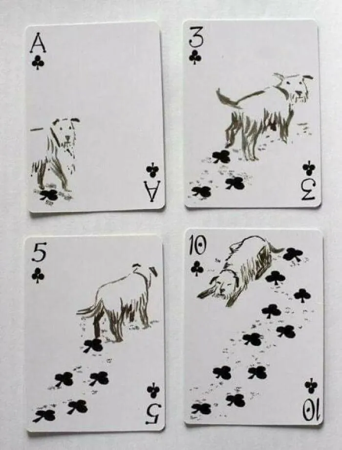 Deck of cards with a dog drawing walking and leaving club-shaped footprints, showing clever ideas.