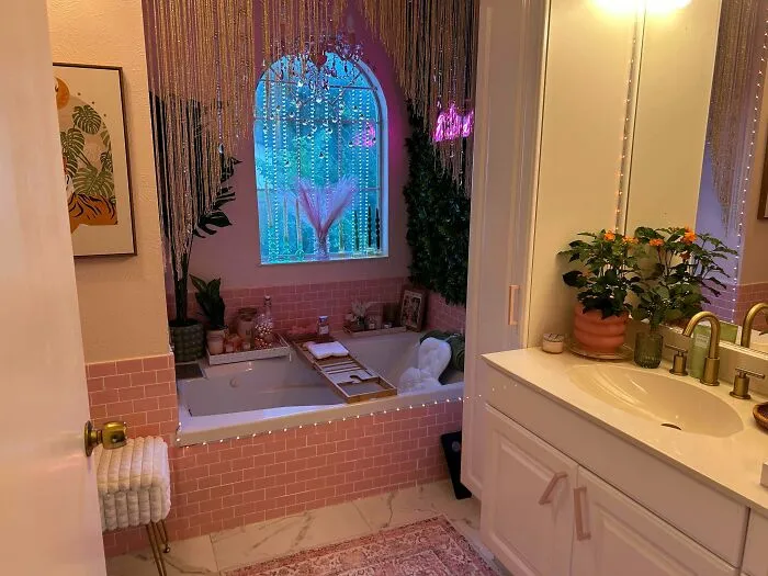 Overdecorated pink bathroom as an example of questionable interior design decisions