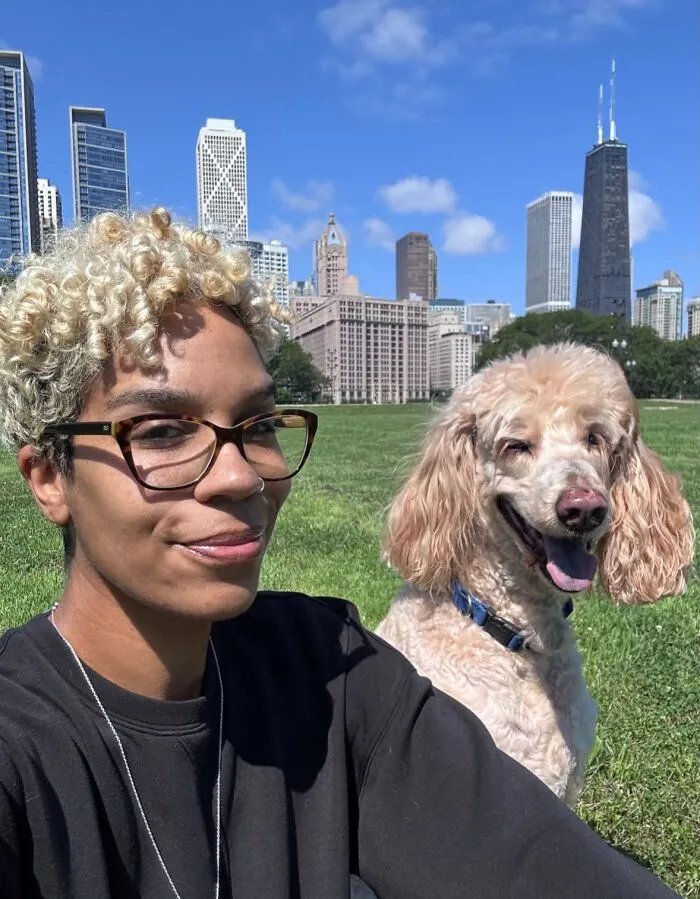 A woman with curly blonde hair and her matching poodle show how pets looked so much like their owners in a park