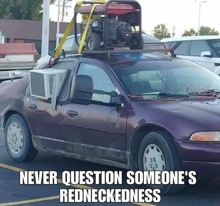 A car with an air conditioner unit taped to the window showcasing creative redneck fixes.