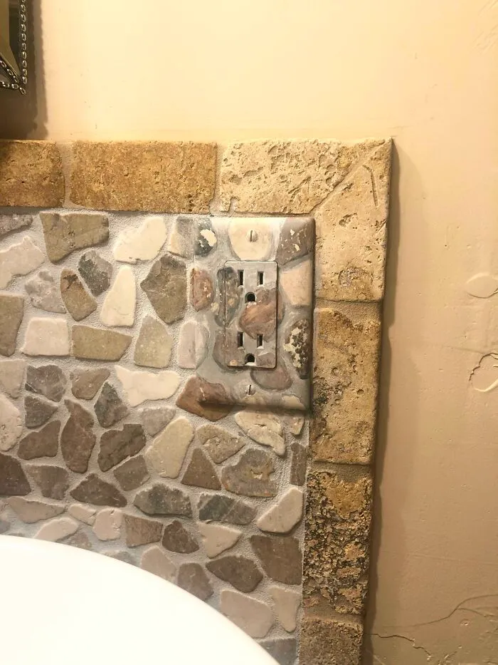 Clever ideas featuring a stone-patterned outlet cover that blends into a wall