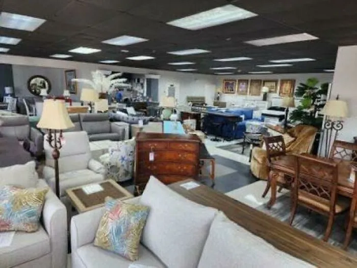 Sprawling furniture showroom packed with sofas, chairs, and dining sets.