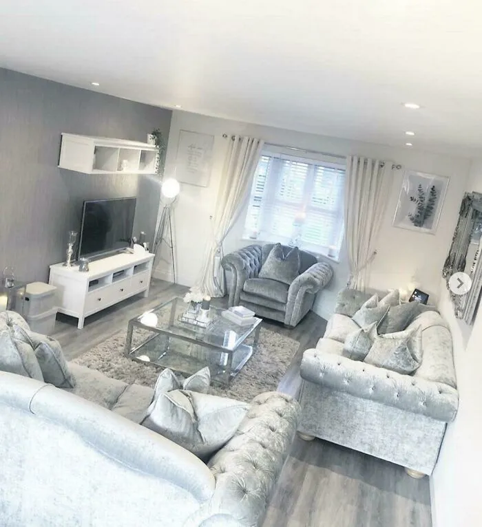 Monochromatic grey living room highlighting modern interior design decisions and plush furniture.