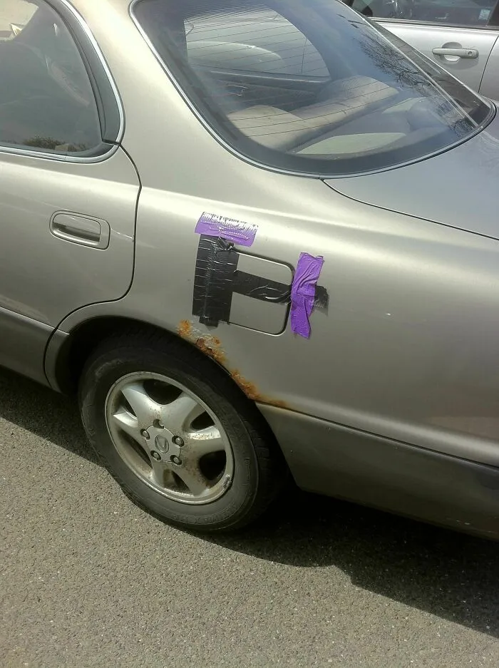 A car gas cap secured with duct tape as one of many redneck fixes.