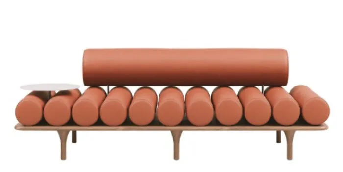 Uncomfortable modern sofa featuring cylindrical cushions as a strange interior design example.