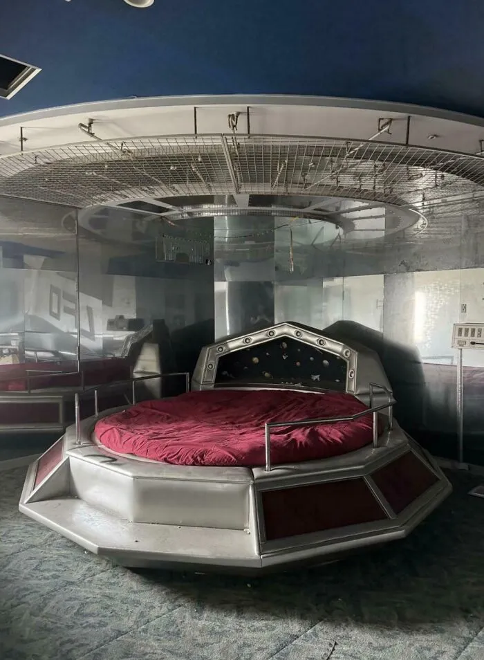 A futuristic spaceship-themed round bed showing a unique interior design decision.