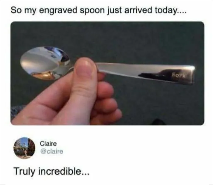 Interesting photo of a hand holding a spoon engraved with the word Fork.