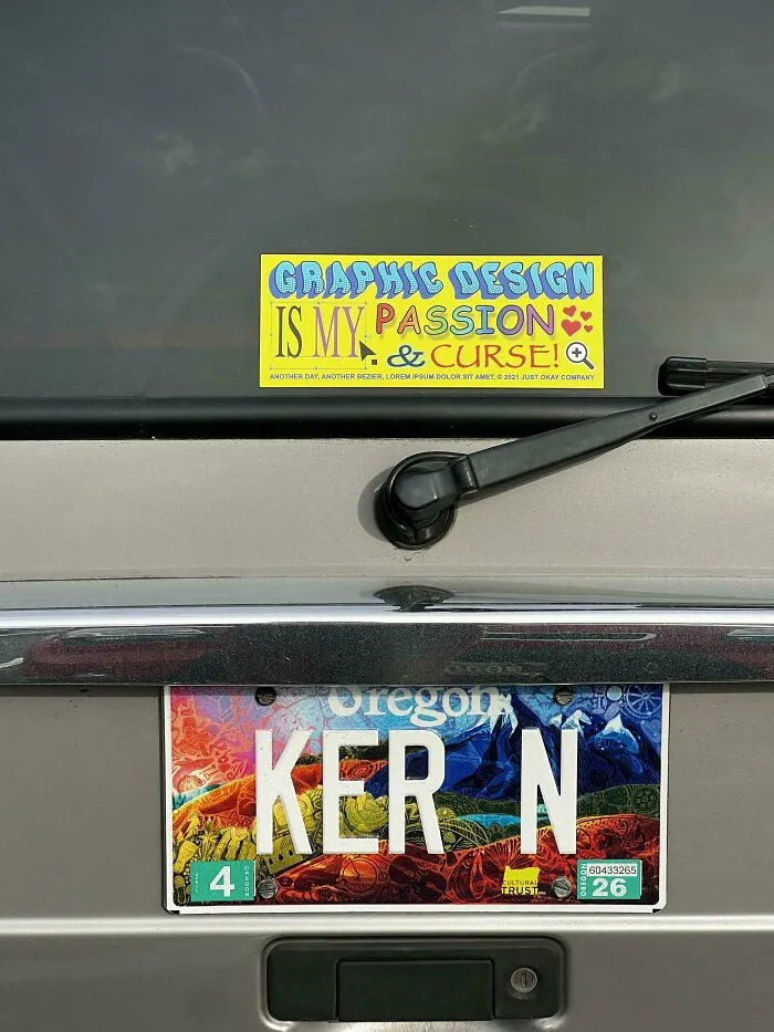 A car bumper with an Oregon license plate reading KER N, showing typography fails in letter spacing.
