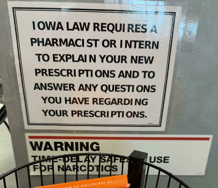 A printed sign in a pharmacy displaying bad letter spacing as an example of typography fails.