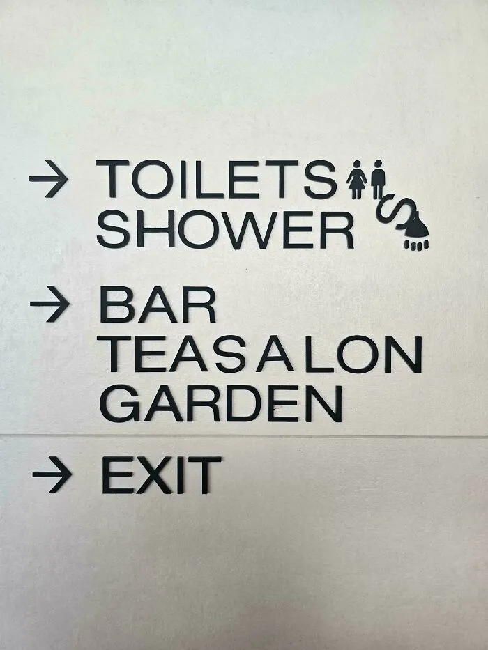 A directory sign with bad letter spacing reading TEASALON instead of Tea Salon, showcasing typography fails.