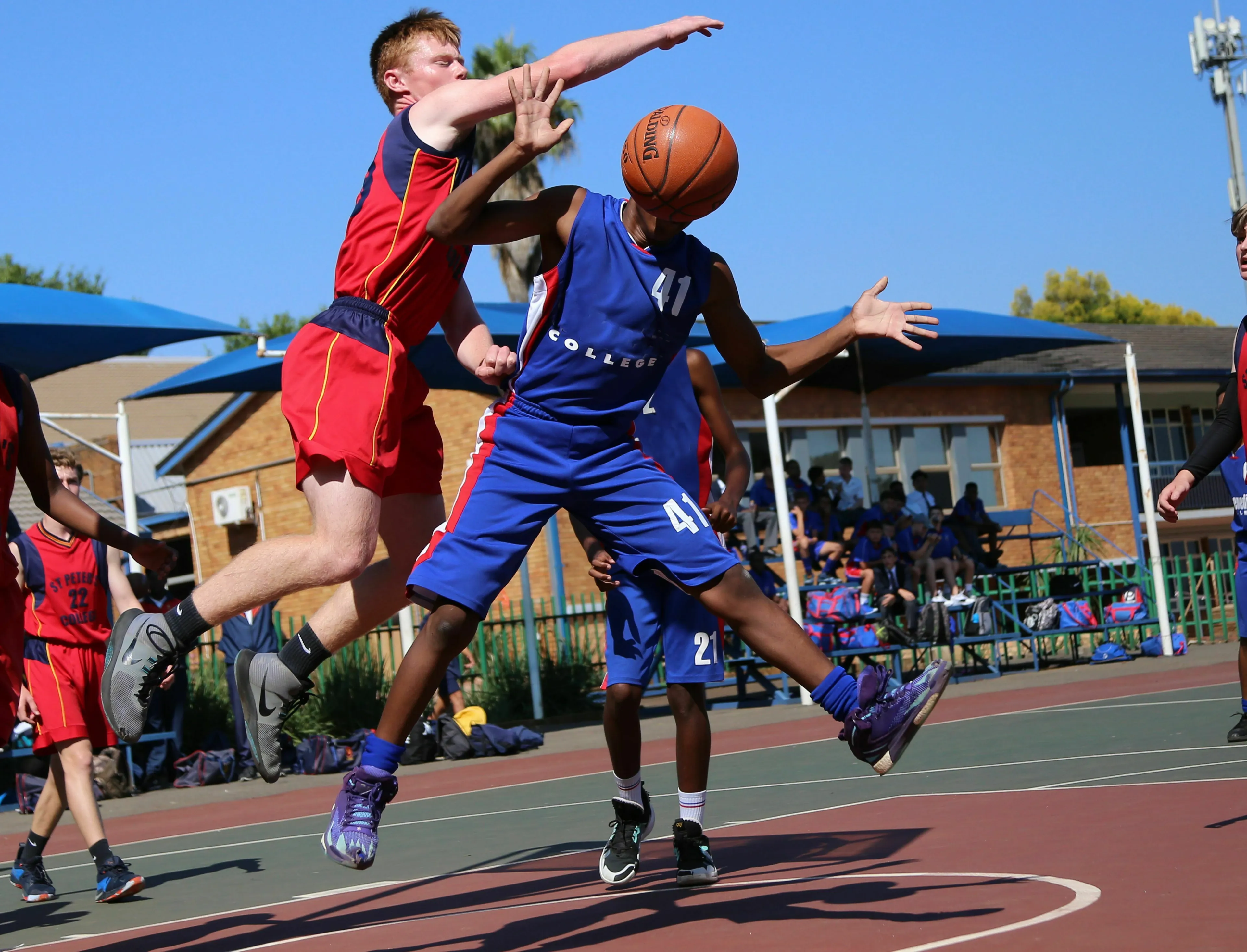 Action shot of basketball players on the court during an intense game