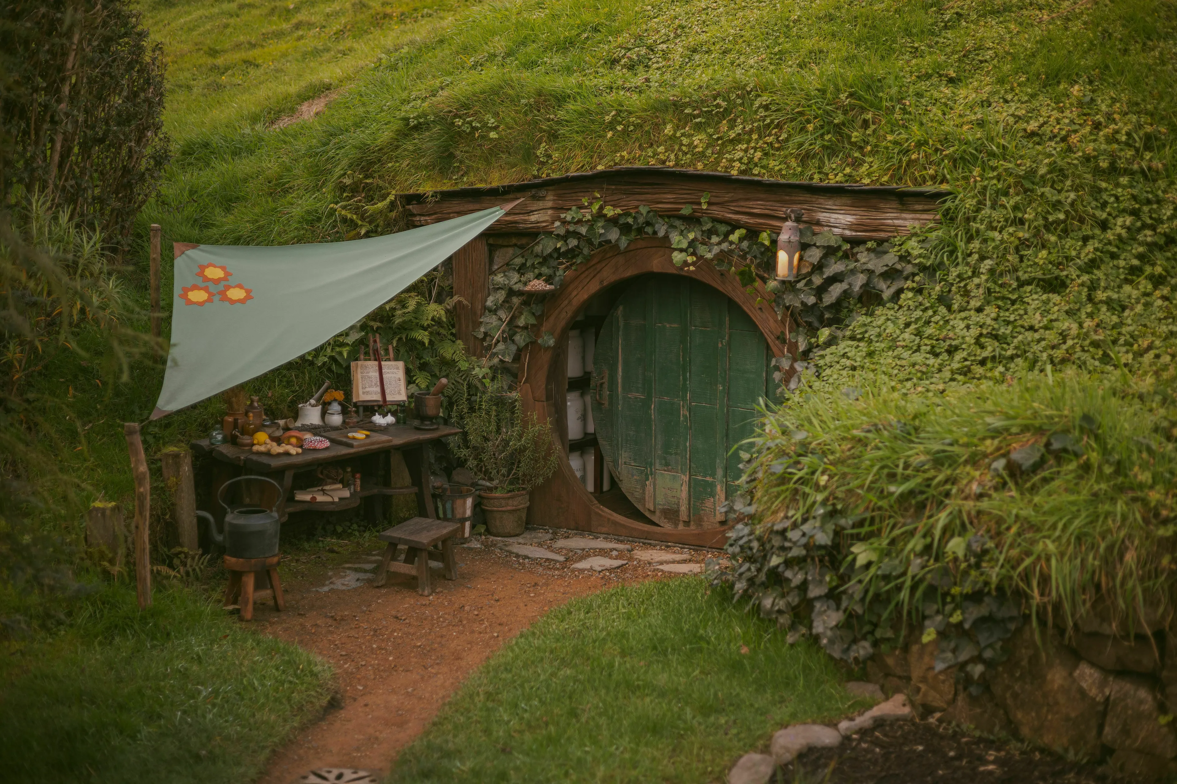 A cozy hobbit hole with a green round door, referencing the hobbit played by Elijah Wood.