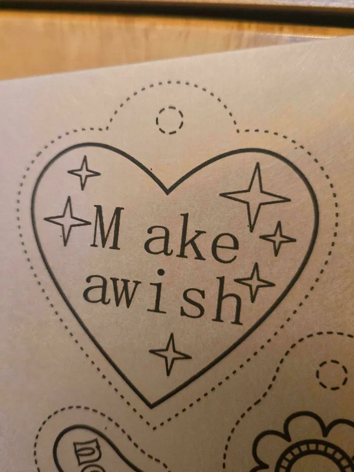 A heart graphic showing a typography fail where Make a wish is spaced as M ake awish.