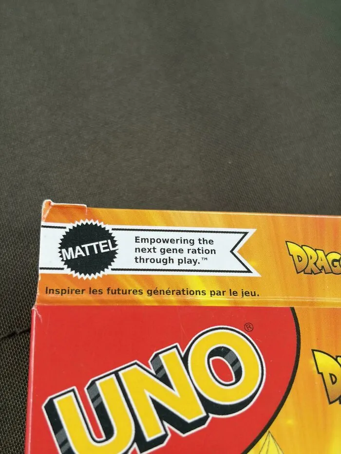 A typography fail on a Mattel card game box showing bad letter spacing in the word generation