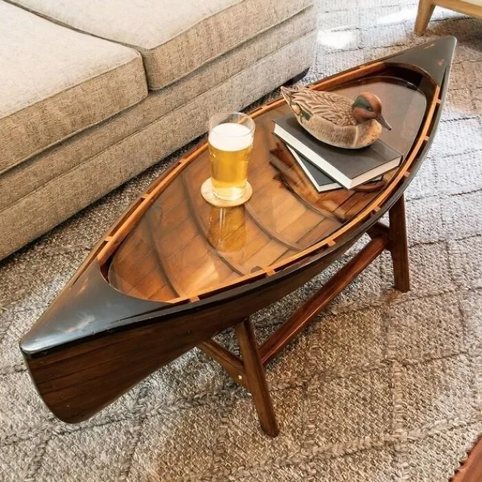 An indoor coffee table shaped like a boat, illustrating clever wooden creations