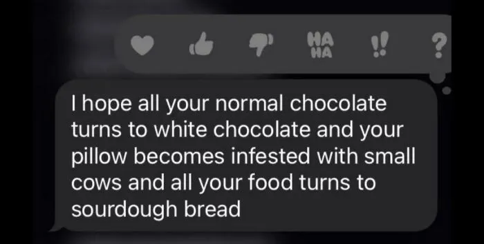 Text message showing oddly accurate insults wishing white chocolate, tiny cows, and sourdough bread on someone.