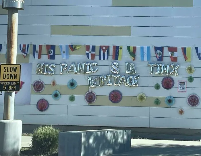 Poor letter spacing in metallic balloon banner showing humorous typography fails