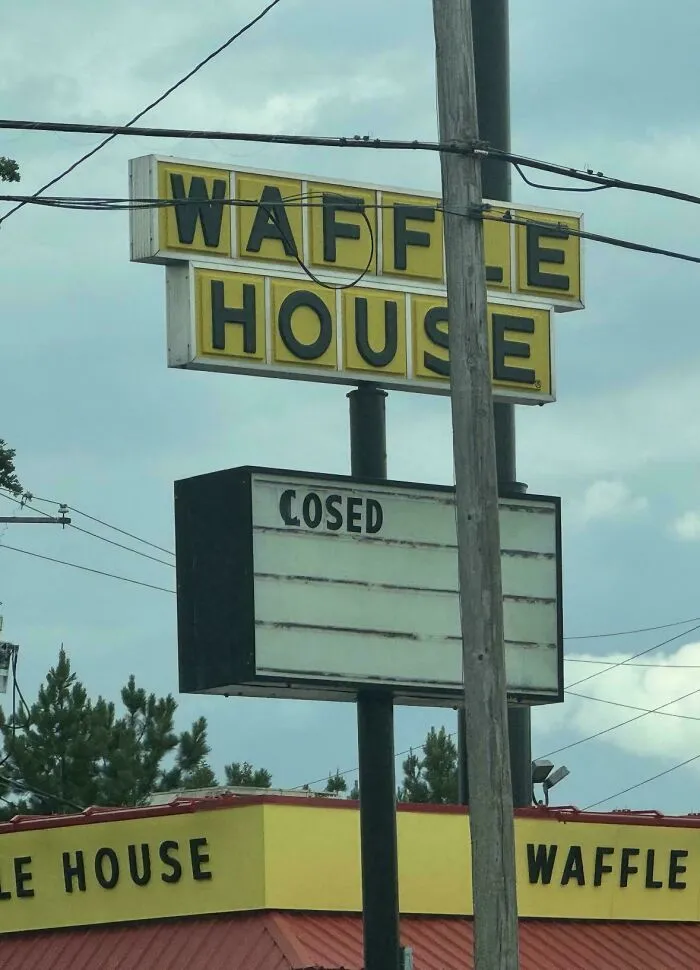 Waffle House sign with missing letters and a cosed sign, displaying bad typography fails.