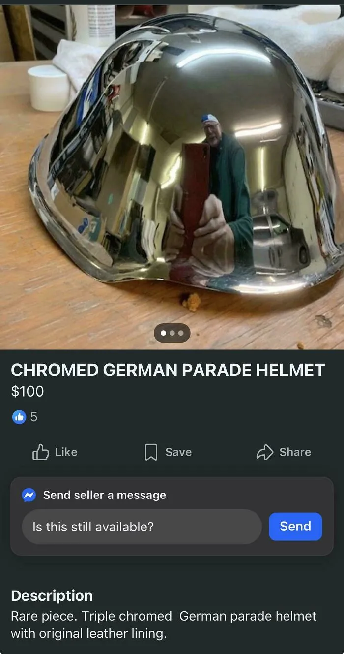 Comical reflection caught in a shiny chrome helmet in mirror pics style.