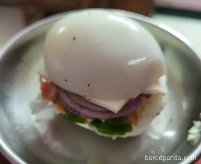 A questionable sandwich decision using a hard-boiled egg as the bun