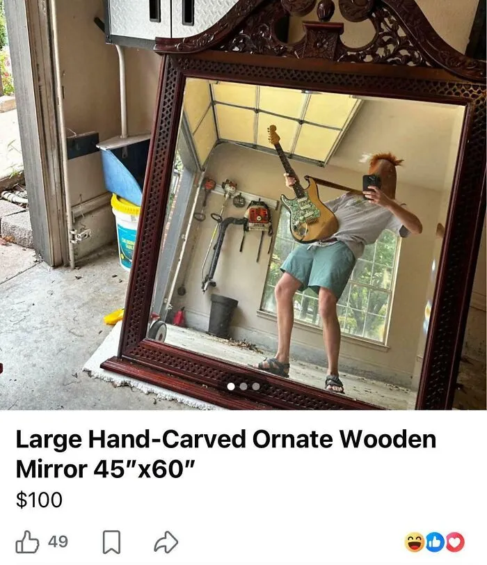 Funny reflection in a mirror pic of a person wearing a mask and holding an electric guitar