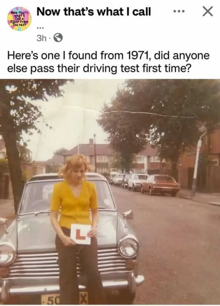 1971 photo of woman standing in front of classic car holding a learner driver plate