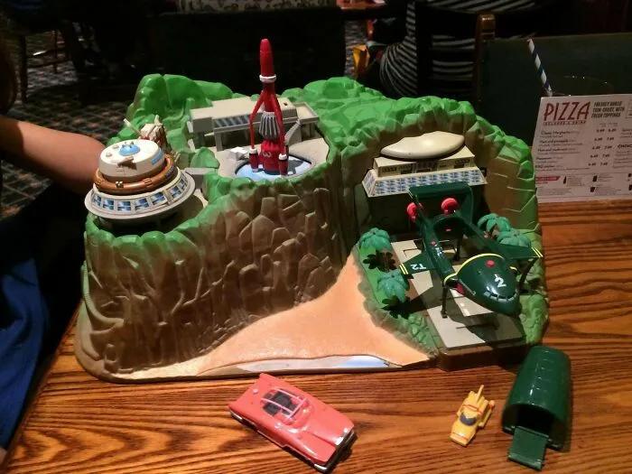 Retro 70s Thunderbirds toy playset with vehicles on table