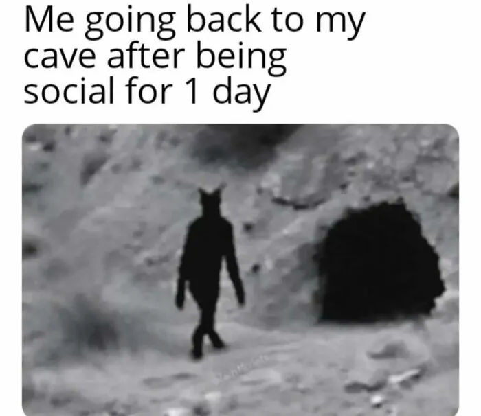 A dark shadowy figure walking back to a cave illustrating relatable memes about social battery