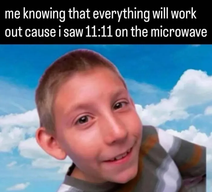 Relatable meme of Dewey from Malcolm in the Middle smiling under text about seeing 11:11 on a microwave.