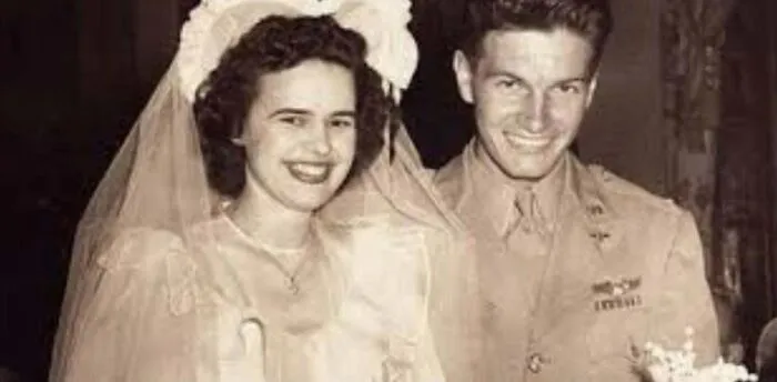 Black and white photo of a smiling couple on their wedding day from weird things about history