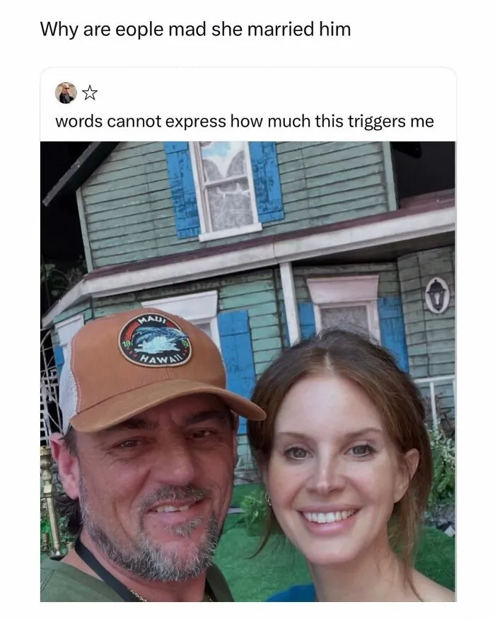 Funny post featuring a selfie of Lana Del Rey and her husband in front of a house.