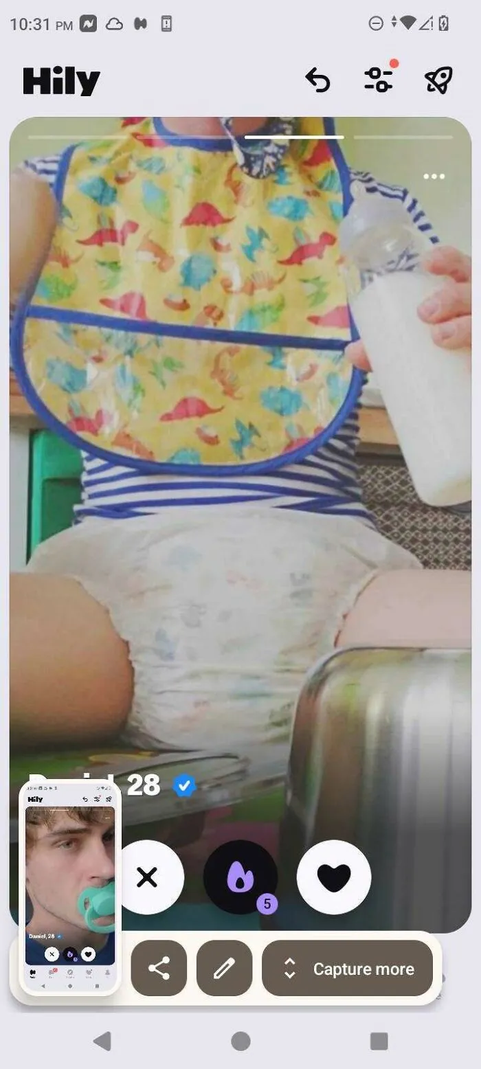 A bizarre and bad dating profile photo featuring an adult wearing a bib and diaper while holding a baby bottle.