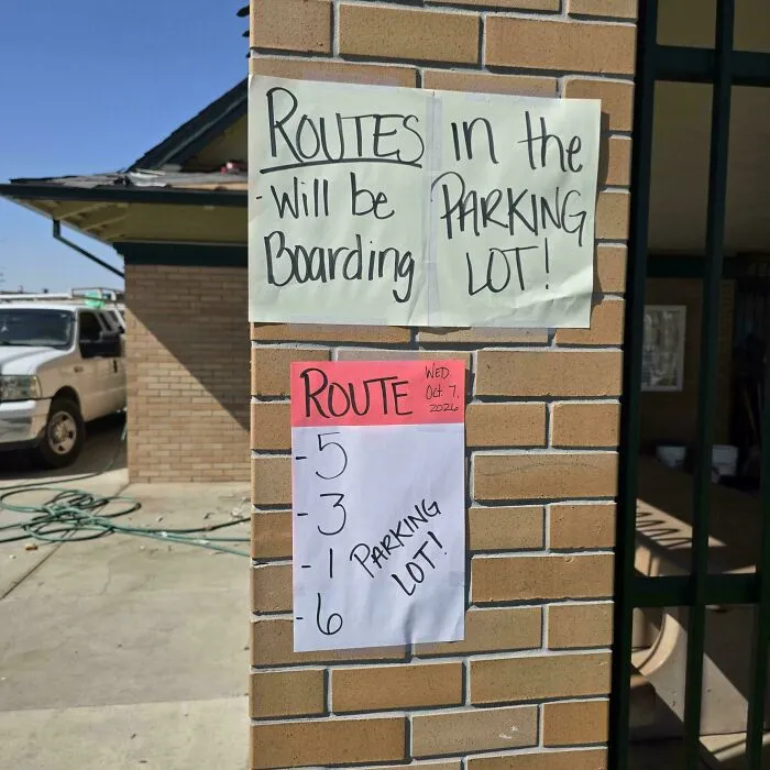 Hilarious badly designed signs with poorly formatted handwritten direction papers on a brick wall