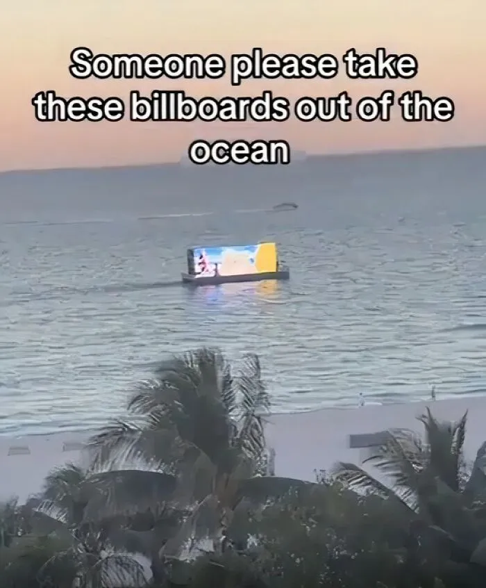 A digital billboard boat on the water exemplifying modern life in America