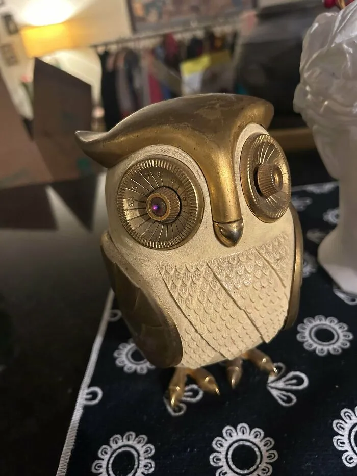 A vintage owl-shaped radio with tuner dials for eyes, showcasing artistic retro gadgets from the past.
