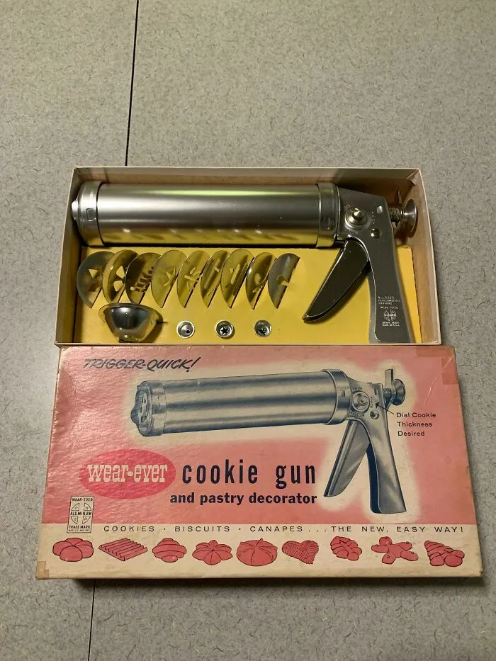 A vintage Wear-Ever aluminum cookie gun set in original box displaying retro gadgets design