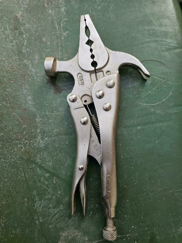 A multi-functional vintage locking pliers tool with built-in hammer representing retro gadgets