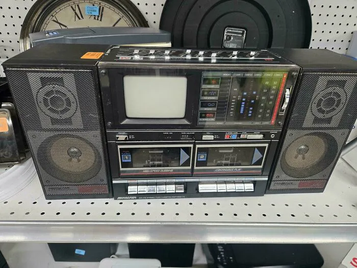 A retro boombox with built-in TV screen representing vintage retro gadgets and audio technology