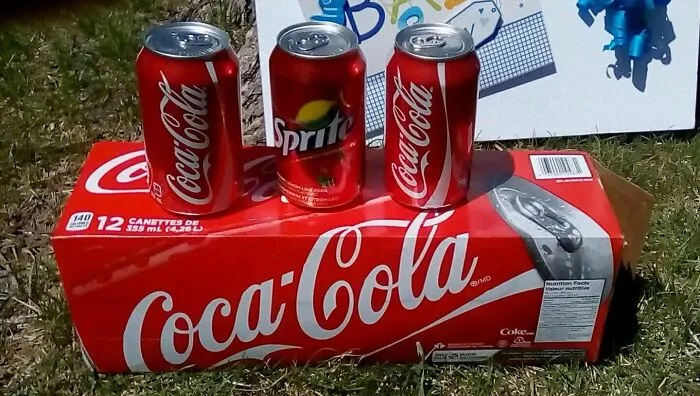 A Sprite soda can packaged inside a Coca-Cola 12-pack, a strange photo of a manufacturing glitch.