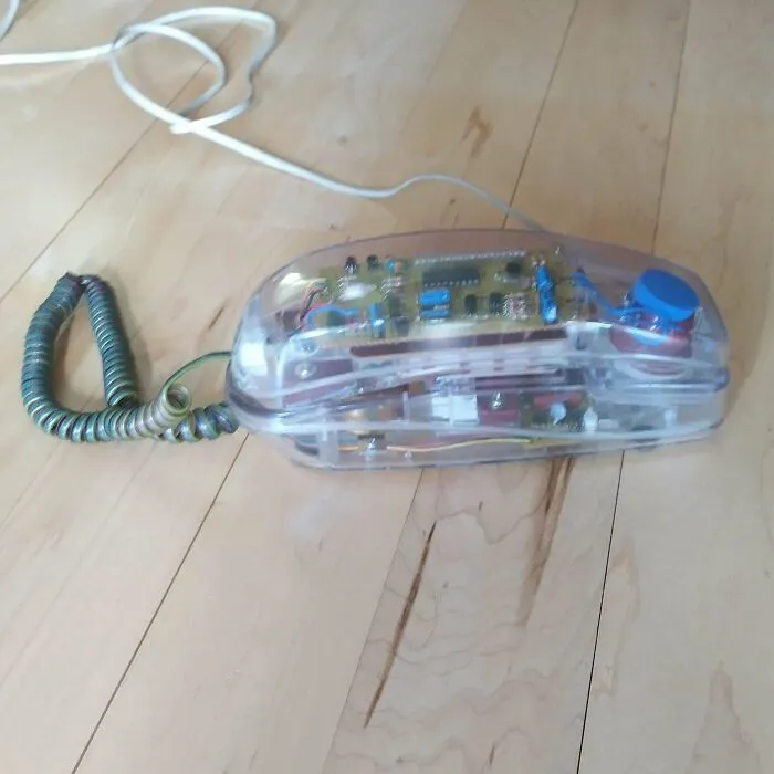 A transparent clear plastic telephone handset as a stylish piece of retro gadgets history