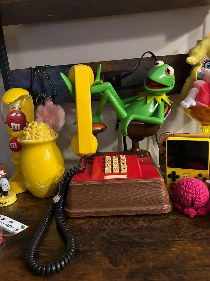 Kermit the Frog novel landline phone representing retro gadgets technology.