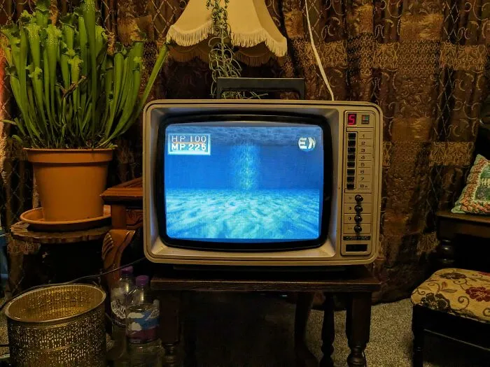 Small classic television set displaying retro gadgets technology.