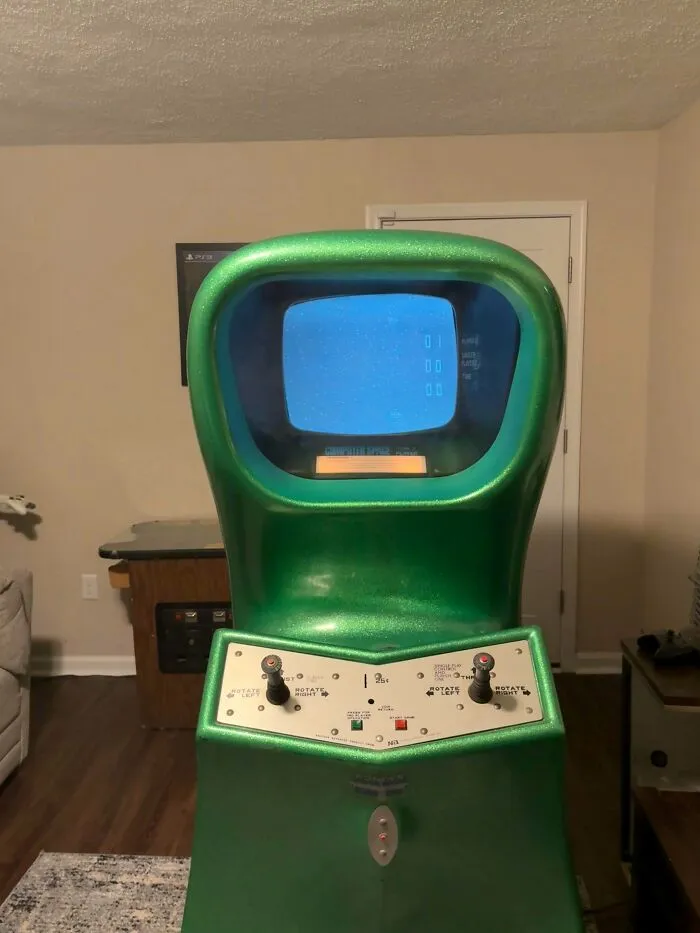 Green metallic vintage Computer Space arcade cabinet as a classic retro gadget
