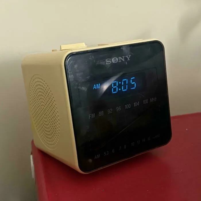 Vintage beige Sony digital alarm clock radio on display as retro gadgets history