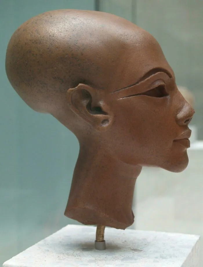 Ancient elongated head sculpture with detailed facial features representing creepy artifacts